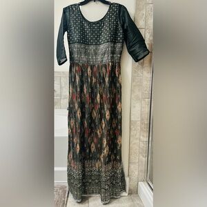 Indian Nyra Cut long dress in olive green color with all over silver stone work